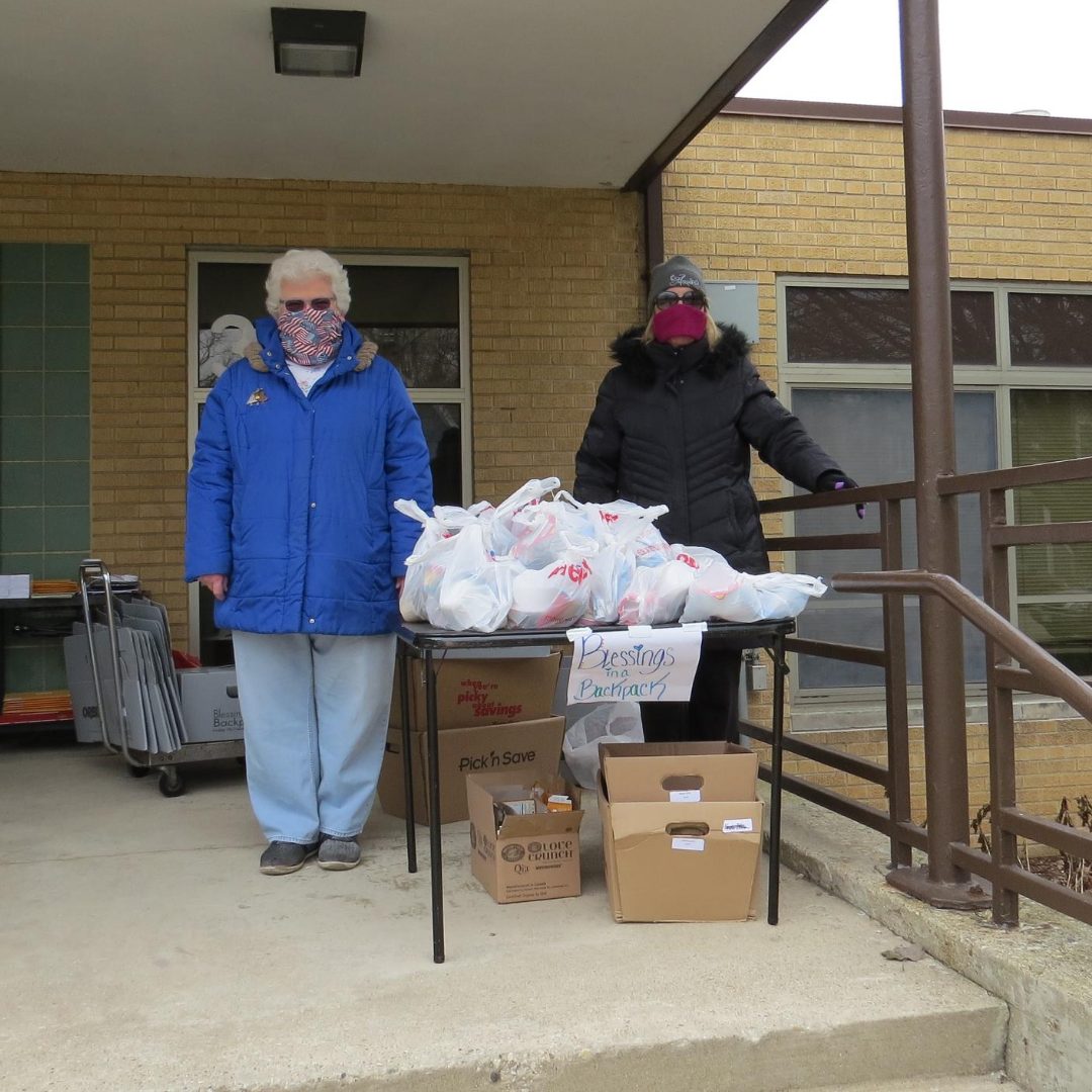 Volunteers handing out food during Covid closures