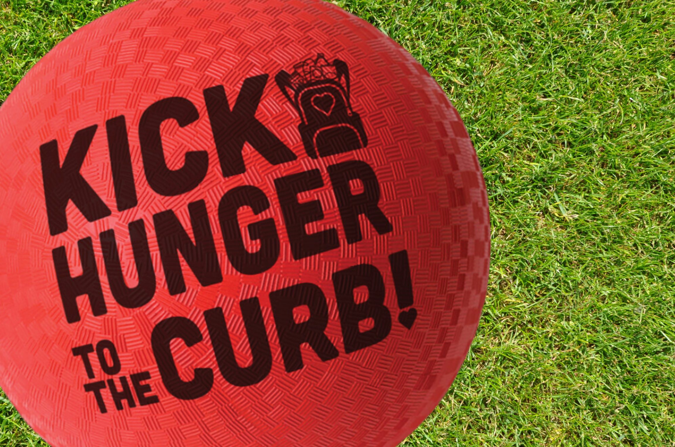 Red kickball that says Kick Hunger to the Curb