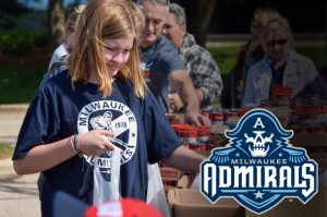 Child packing a bag of food